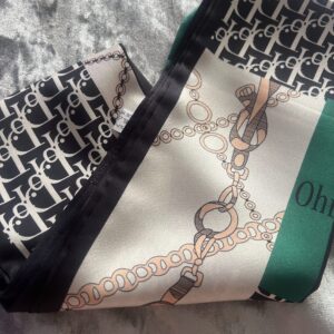 Close-up of a patterned fabric with chains and geometric designs.